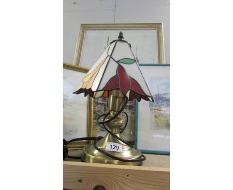 A table lamp with Tiffany style shade.