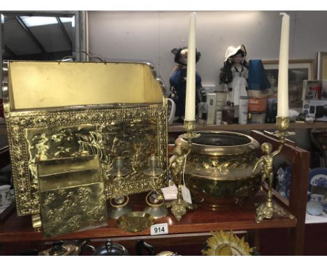 A shelf of brassware including magazine rack etc.