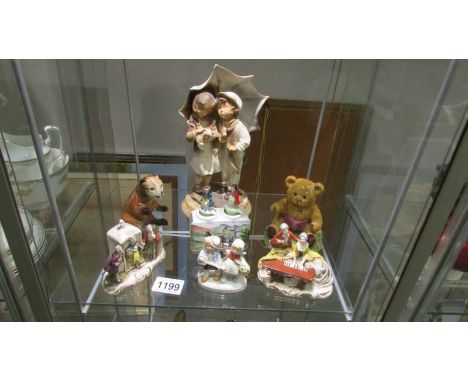 A mid 20th century ceramic figure of children on a marble base together with other continental figures.