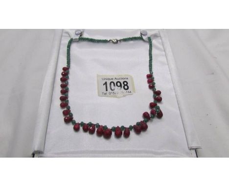 A ruby and emerald necklace.