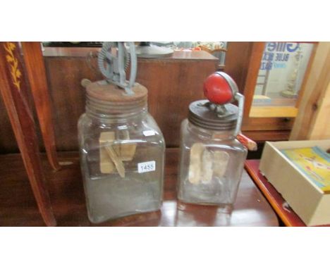 2 vintage churn jars.