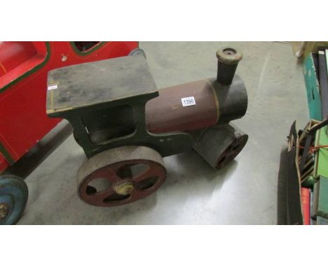 A metal and wood steam roller.