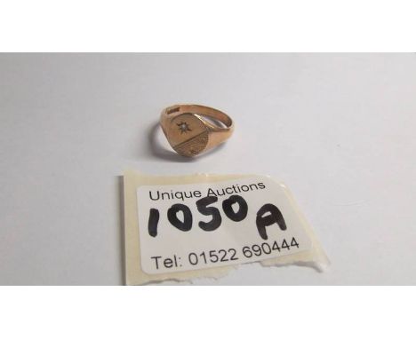 A 9ct gold signet ring set diamond chip, size X.  4.8 grams.