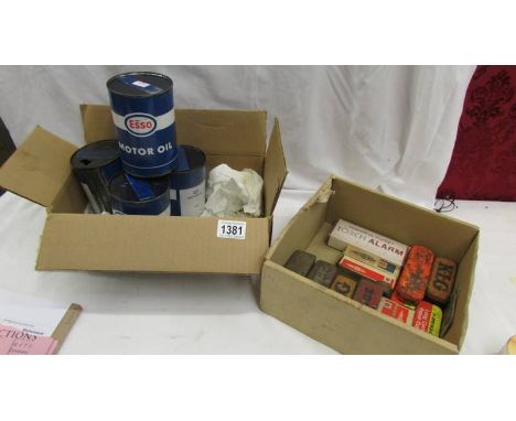 4 Esso motor oil cans (some with contents) and a box of spark plug tins etc., ****Condition report**** 3 tins are full, 1 has