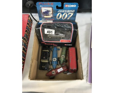 A mixed lot of play worn die cast racing cars, American police car, double decker bus and a boxed Corgi Aston Martin V12 Vanq