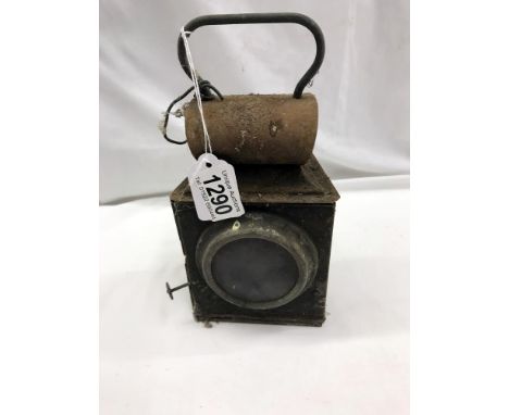 An old railway lamp in need of restoration.