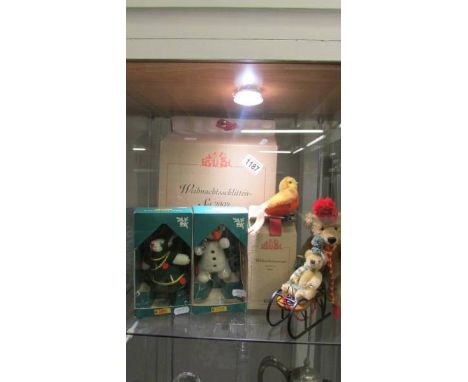 A boxed Steiff Christmas set 2002, a Teddy with Sledge, a small Teddy, a Boxed Christmas Robin and 2 Steiff Christmas figures