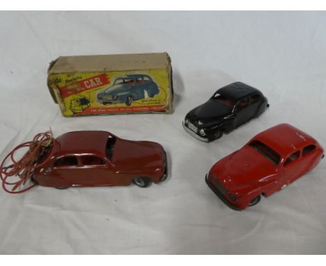 A boxed Chad Valley remote controlled car with accessories and two similar un-boxed clock-work cars (3)