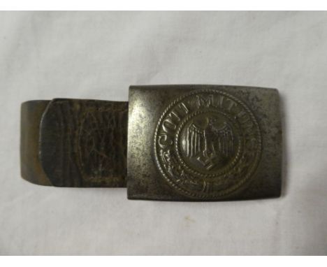 An original German Second War Army steel buckle with part leather strap