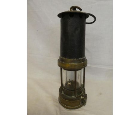 An old brass &amp; steel miner's lamp with swing handle