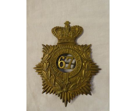 A Victorian brass ordinary ranks helmet plate of the 67th Regiment of Foot with detachable centre