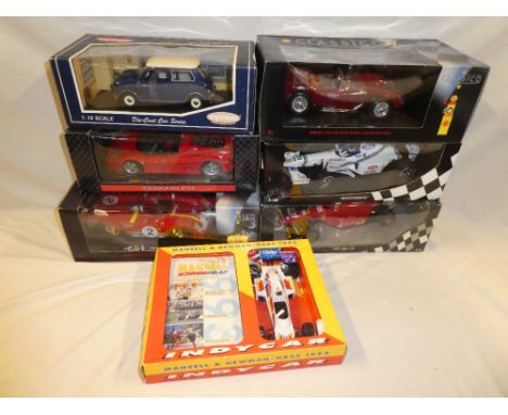 Six 1:18 scale die-cast vehicles including two Mini champs F1 vehicles, Shell Classico Ferrari and others together with a Man