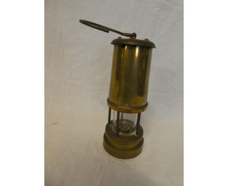 A brass Miner's lamp with swing handle