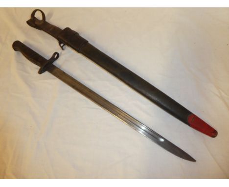 A United States First War Remington bayonet dated 1917 in leather scabbard