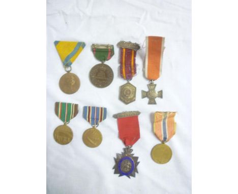 A selection of various Foreign medals including French First War prisoners medal, American European African and Middle Easter