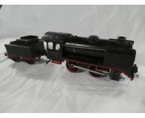 A Marklin O gauge 0-4-0 clockwork locomotive and tin plate tender