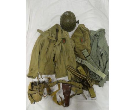 A US Army uniform comprising olive green jacket together with shirts; 1942 dated belt with straps, canteen and leather holste