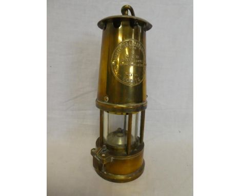 An all-brass Miner's lamp by the Protector Lamp &amp; Lighting Co Ltd