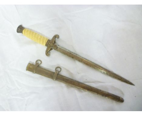 An original German Nazi Second War Army Officers dagger with double edged steel blade, white grip and traditional mounts with