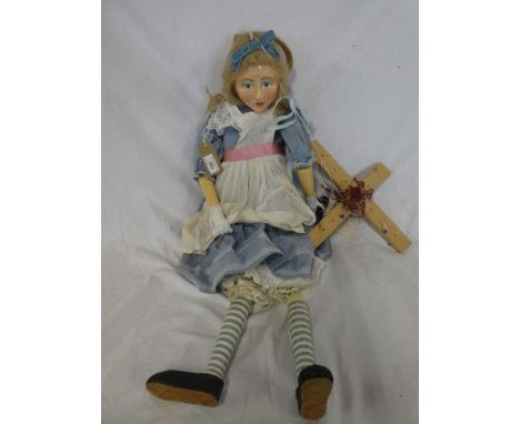 A large wooden jointed puppet of Alice from Alice in Wonderland 32" long