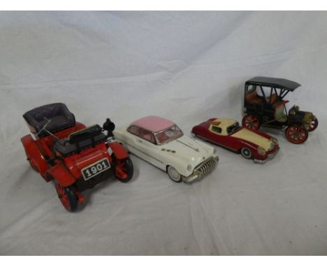 A battery operated vintage-style car and three other various metal cars (4)