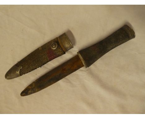 A 19th Century Indian hunting dagger by Boput of Nagpore with 6" inch double edged blade, chequered hilt with silver plated m