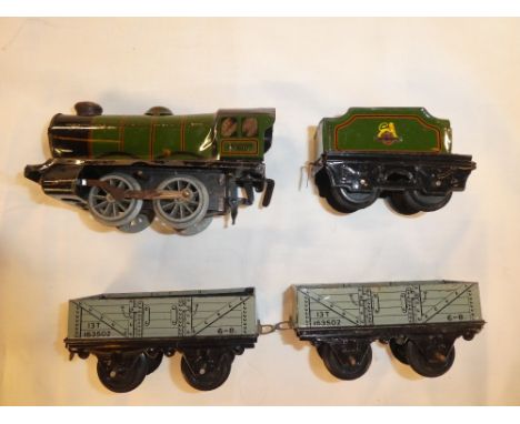 Hornby O gauge - clockwork tin plate engine and tender and two open coal trucks
