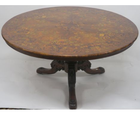 A VICTORIAN WALNUT CIRCULAR BREAKFAST TABLE, inlaid with various woods on a carved baluster base with tripod carved legs, 133