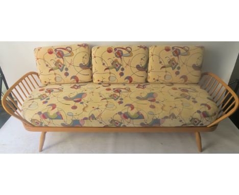 AN ERCOL STUDIO COUCH/DAY BED with backboard and original Ercol cushions, 77cm high x 207cm wide x 84cm deep Condition Report