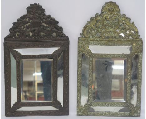 A BRASS CUSHION SHAPED MIRROR, 60cm x 33cm and a similar cushion mirror, 60cm x 33cm (2) Condition Report: Available upon req