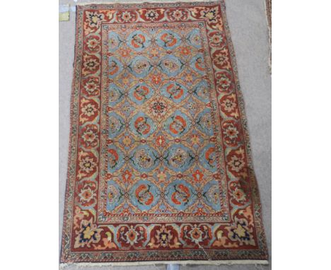 A LIGHT BLUE GROUND EASTERN RUG With allover design within a red border, 170cm x 106cm Condition Report: Available upon reque