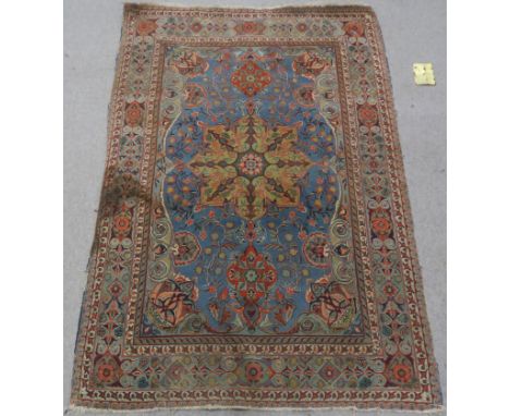 A LIGHT BLUE GROUND EASTERN RUG, with central medallion, 210cm x 140cm Condition Report:Fringes and edges in very poor condit