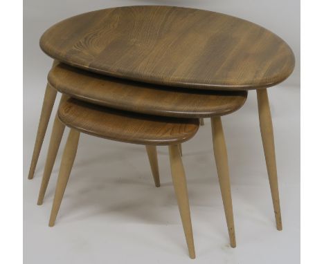 A NEST OF THREE ERCOL PEBBLE TABLES, 40cm high x 65cm wide x 44cm deep Condition Report:&nbsp;Some scratches, small dents and