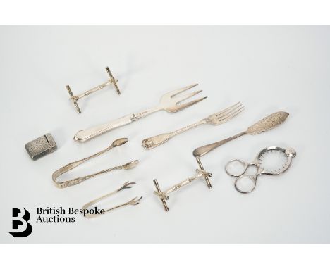 A silver three-pronged bread fork, Sheffield hallmark dated 1927, mm Mappin &amp; Webb, approx 25 cms; two silver knife rests