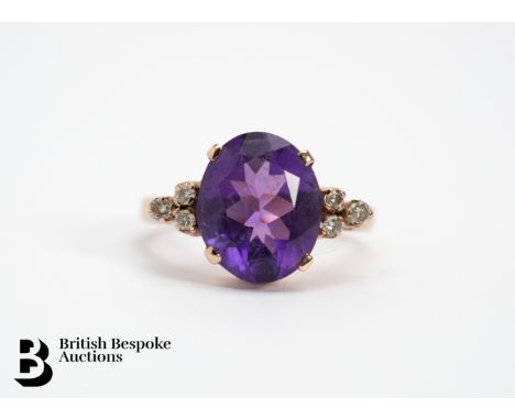 Lady's 14ct yellow gold, amethyst and diamond ring, size J, approx. 3.6 gms. The ring set with an oval amethyst measuring 12 