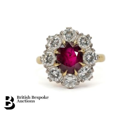 18ct yellow gold ruby and diamond ring. The ring set with an oval natural ruby, measures 9 x 7mm, surrounded by 2cts of diamo