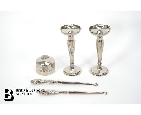 A pair of silver bud vases, Birmingham hallmark dated 1927, mm S &amp; Co, 13 cms h, approx. 138.6 gms; two silver-handled bu