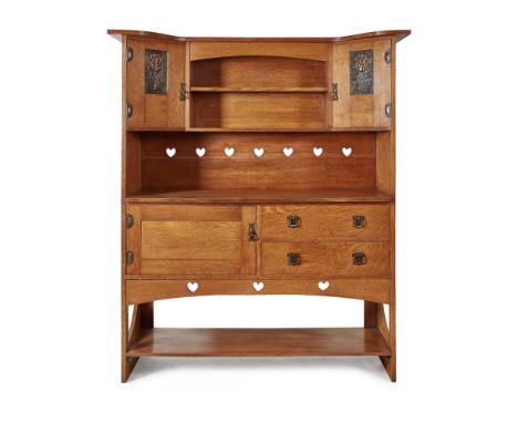 BATH CABINETMAKERS ARTS &amp; CRAFTS OAK DRESSER, CIRCA 1900 the superstructure with twin doors with embossed copper panels a