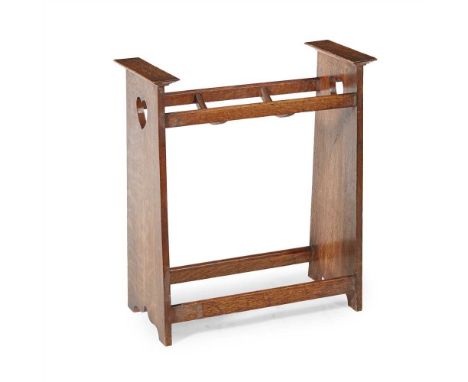MANNER OF LIBERTY &amp; CO. ARTS &amp; CRAFTS OAK STICK STAND, CIRCA 1900 the tapering sides pierced with hearts (Dimensions:
