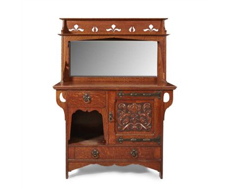 WARING &amp; GILLOW, MANCHESTER ARTS &amp; CRAFTS OAK SIDEBOARD, CIRCA 1900 the pierced cornice above a mirrored backboard, a