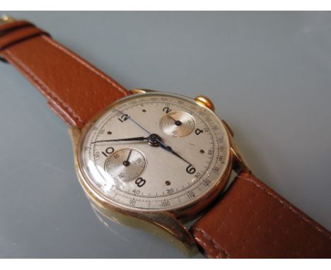 18ct Gold cased chronograph wristwatch, the silvered dial with twin subsidiaries and sweep seconds on a brown leather strap