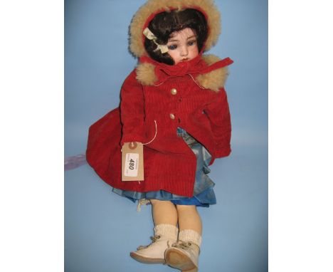 Simon Halbig bisque headed doll with open mouth, two teeth and sleeping eyes on a jointed composition body wearing a red fur 