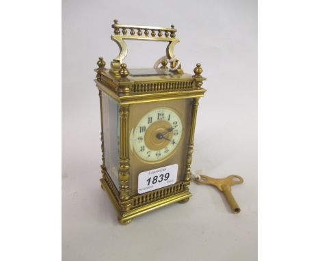 Late 19th or early 20th Century brass cased carriage clock, the gallery top above corner pilasters , the circular enamel dial
