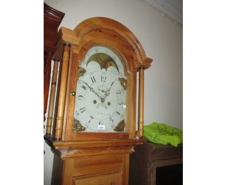 Pine longcase clock with broken arch hood above a rectangular door and plinth base, the painted dial with Arabic numerals, mo