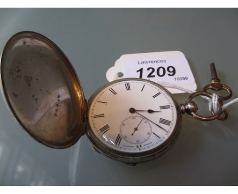Continental white metal cased full hunter pocket watch with engine turned case, the enamel dial with Roman numerals and subsi