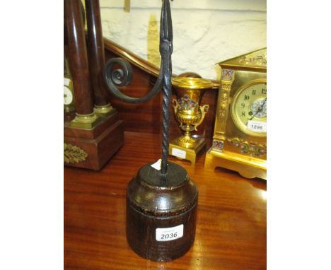 Antique wrought iron rush light on circular turned oak base, 13.25ins high