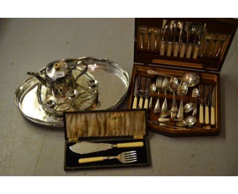 Oval two handled galleried tray, salver, teapot, candlestick, pair of fish servers and a plated canteen of cutlery