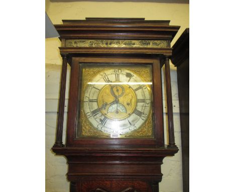 George III oak and mahogany crossbanded longcase clock, the pagoda top with a painted glass frieze above a shaped door flanke