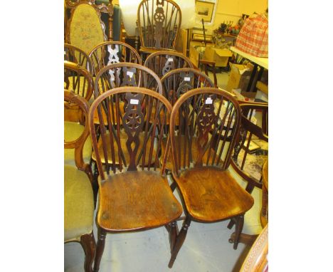 Set of eight 19th Century elm and beech Windsor chairs with wheel and stick backs, panel seats, turned supports and stretcher