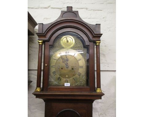 George III oak longcase clock, the broken arch hood above a crossbanded arched panel door and conforming plinth base, the bra